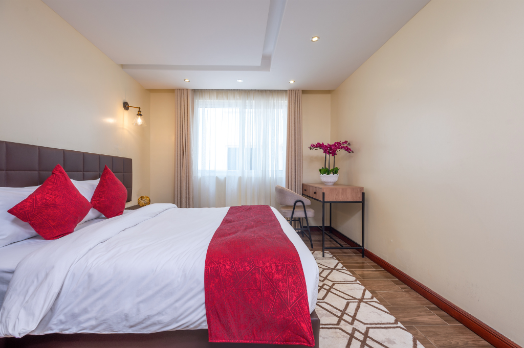1 Bedroom Apartment bedroom with study table at Roma Courts Nairobi